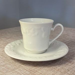 White fruit and flower cup and saucer